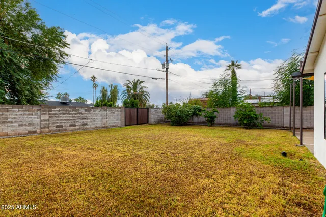 a view of a swimming pool and an outdoor space