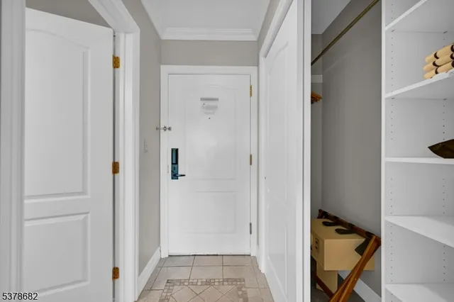 a view of a hallway with elevator and hallway
