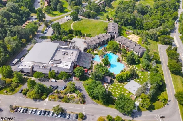 an aerial view of a house with a garden