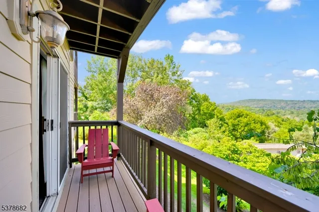 a view of balcony with wooden floor