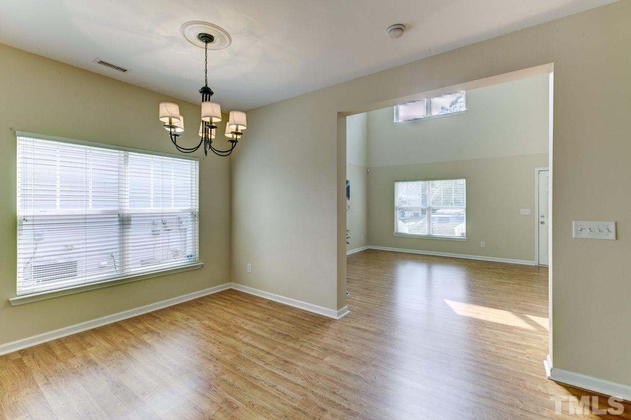 3620 Pinkham Way Raleigh, NC 27616 - Photo 15 of 25 a view of a room with wooden floor chandelier and windows