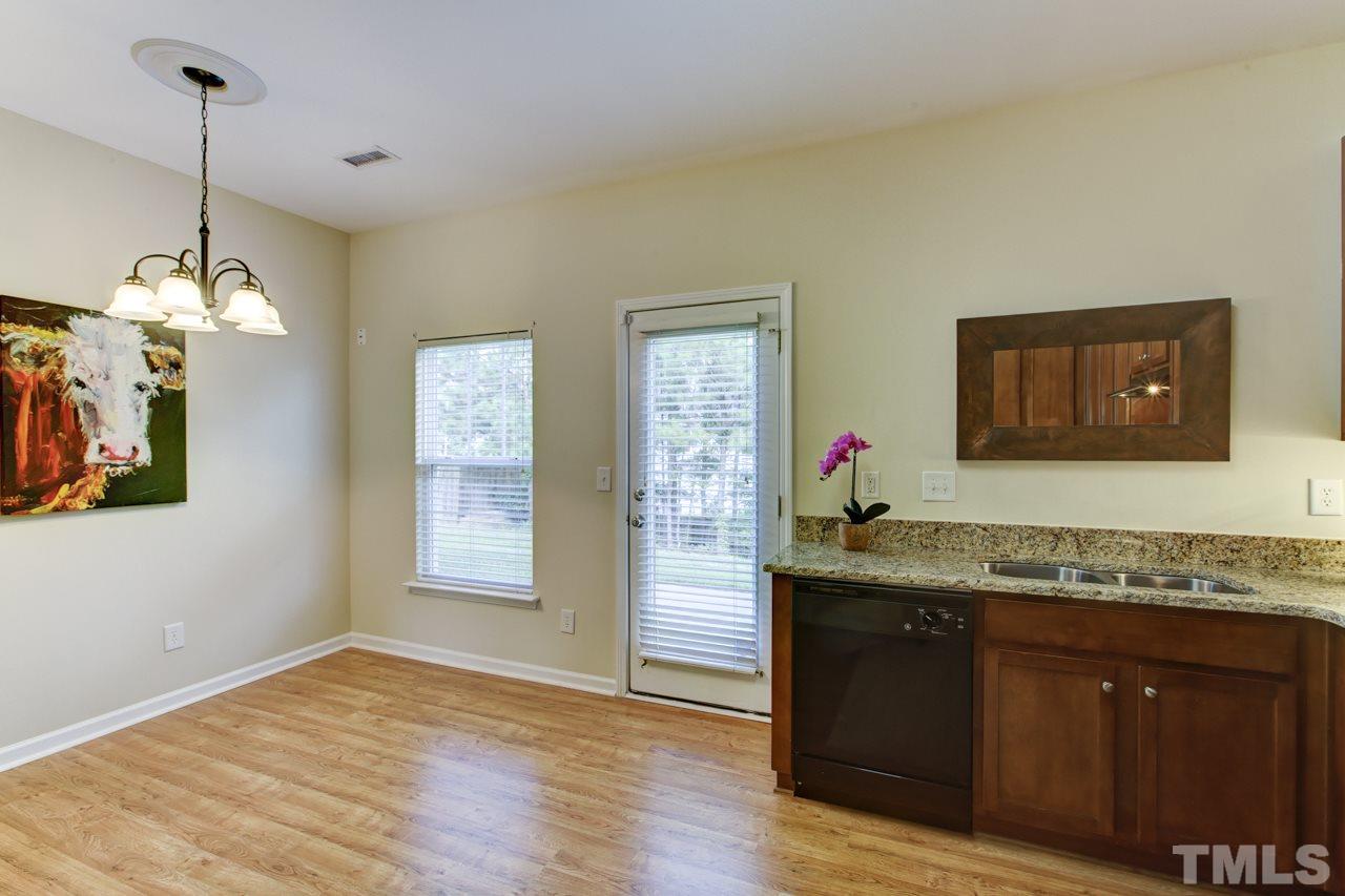 3620 Pinkham Way Raleigh, NC 27616 - Photo 5 of 25 a bathroom with a granite countertop sink vanity and mirror