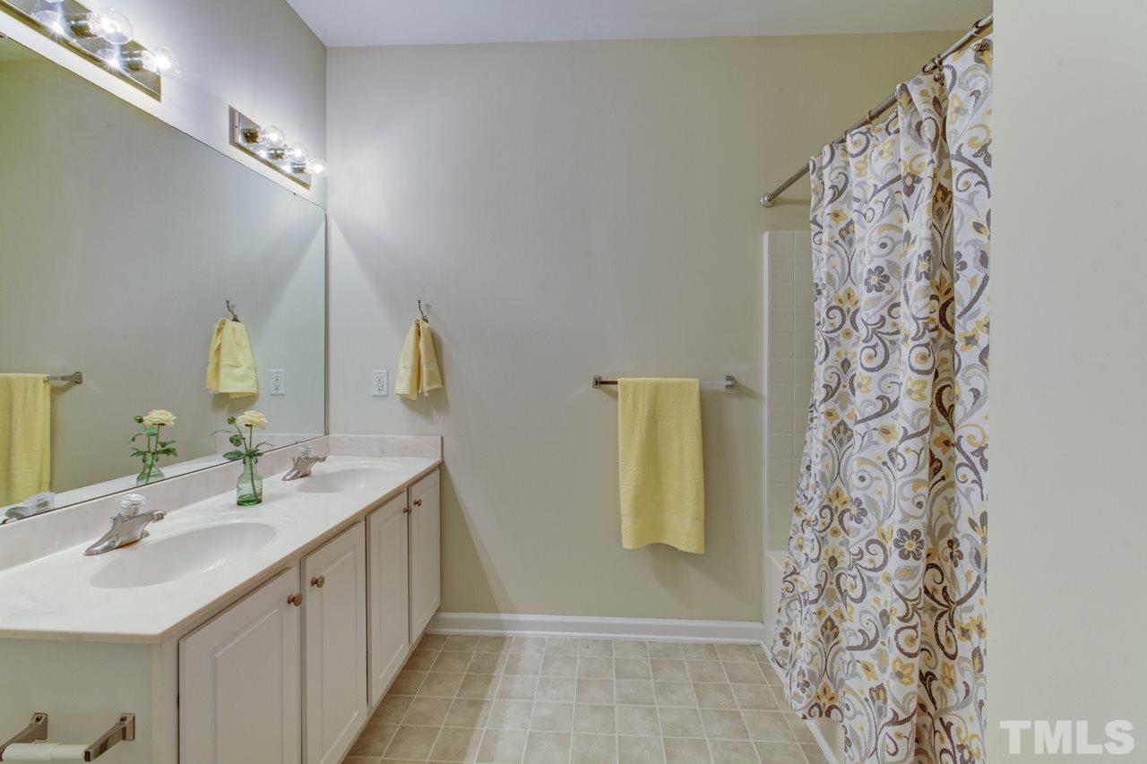 3620 Pinkham Way Raleigh, NC 27616 - Photo 10 of 25 a bathroom with a sink and a mirror