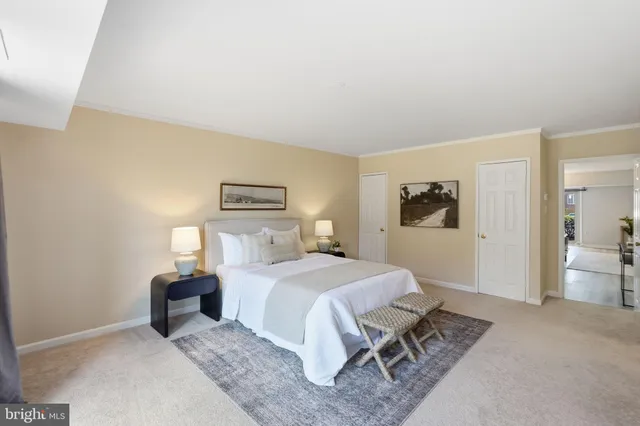 a bedroom with a bed and lamp