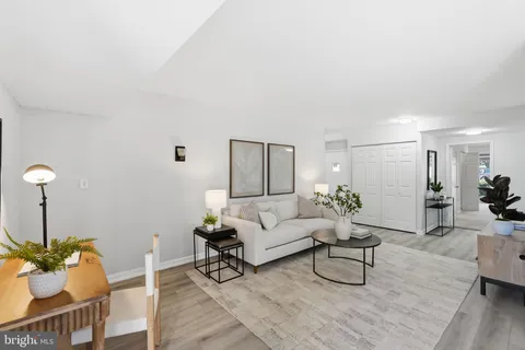 a living room with furniture and a rug