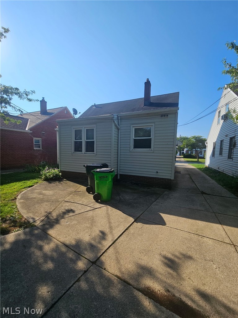 4237 Stonehaven Road South Euclid, OH 44121 - Photo 5 of 35 Siding exterior with multiple windows and a concrete driveway