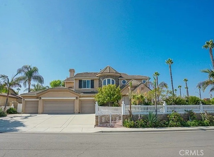 12683 Palm View Way Riverside, CA 92503 - Photo 1 of 25 a front view of a house with a yard and potted plants