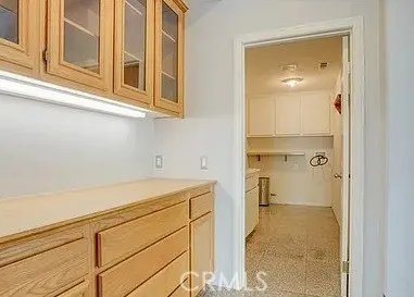 a bathroom with a sink and cabinets