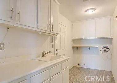 12683 Palm View Way Riverside, CA 92503 - Photo 14 of 25 a bathroom with a sink and cabinets