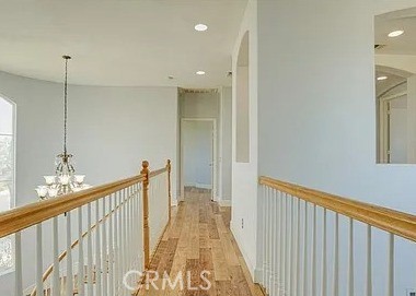 12683 Palm View Way Riverside, CA 92503 - Photo 17 of 25 a view of a hallway with chandelier