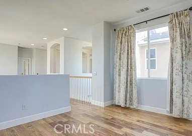 12683 Palm View Way Riverside, CA 92503 - Photo 18 of 25 a view of an empty room with wooden floor and a window