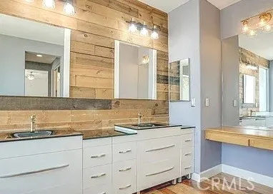 a bathroom with a bathtub sink and mirror