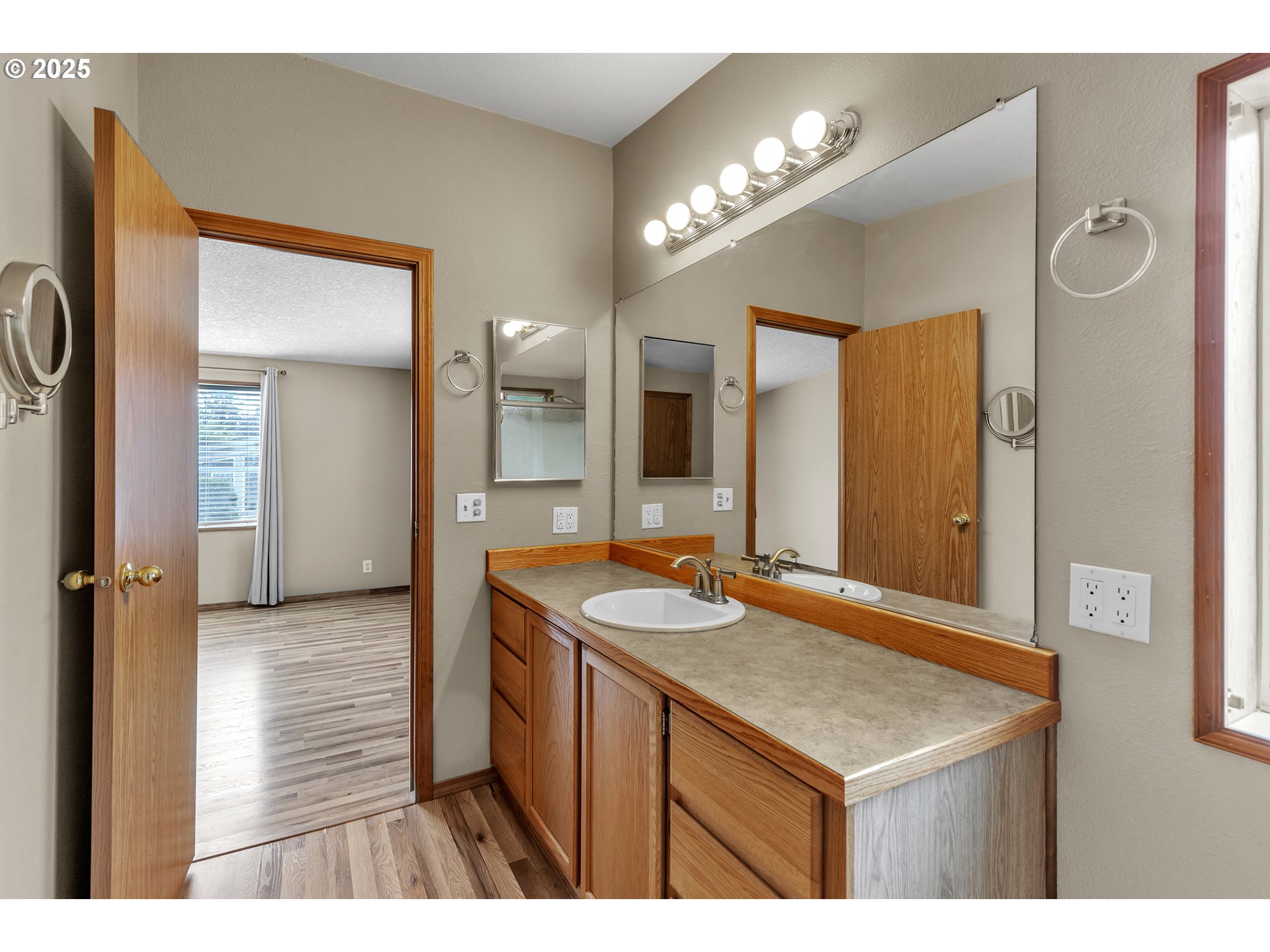 5701 Northeast St Johns Road, Unit 4 Vancouver, WA 98661 - Photo 13 of 28 a bathroom with a sink a vanity and a mirror