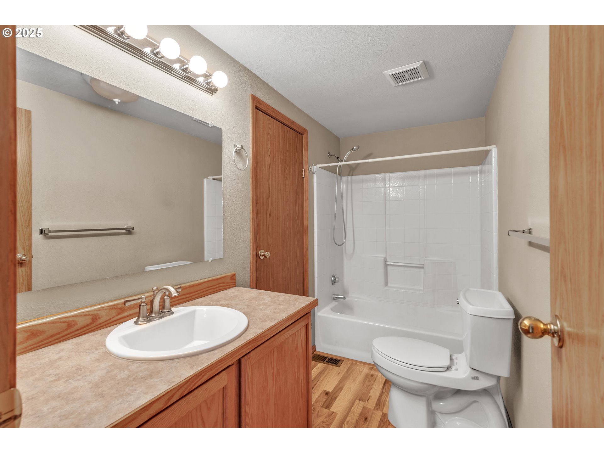 5701 Northeast St Johns Road, Unit 4 Vancouver, WA 98661 - Photo 15 of 28 a bathroom with a sink toilet a mirror and shower