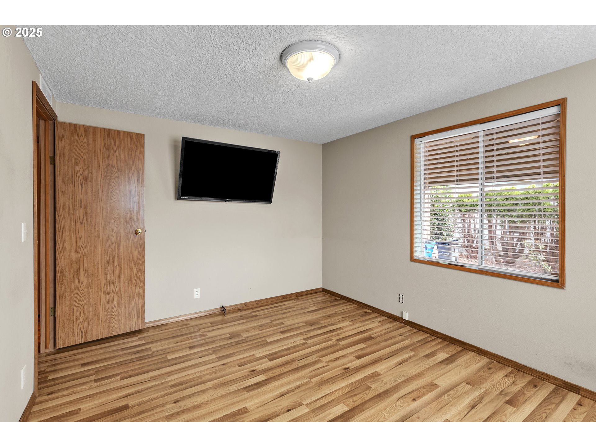 5701 Northeast St Johns Road, Unit 4 Vancouver, WA 98661 - Photo 17 of 28 a view of an empty room with a flat screen tv