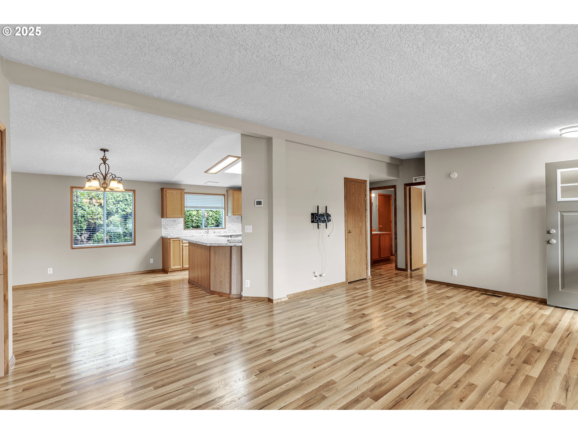 5701 Northeast St Johns Road, Unit 4 Vancouver, WA 98661 - Photo 5 of 28 a view of an empty room and wooden floor