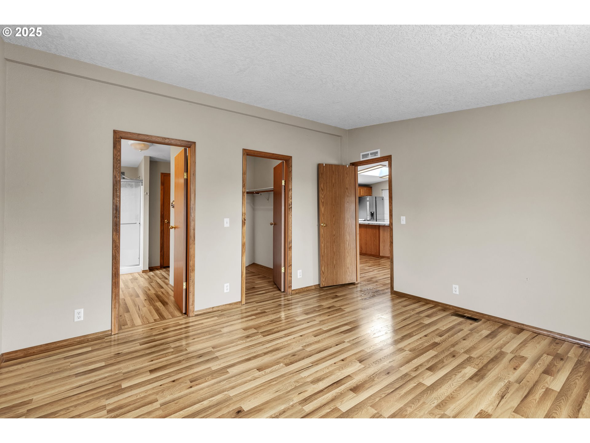 5701 Northeast St Johns Road, Unit 4 Vancouver, WA 98661 - Photo 6 of 28 a view of an empty room with wooden floor and closet