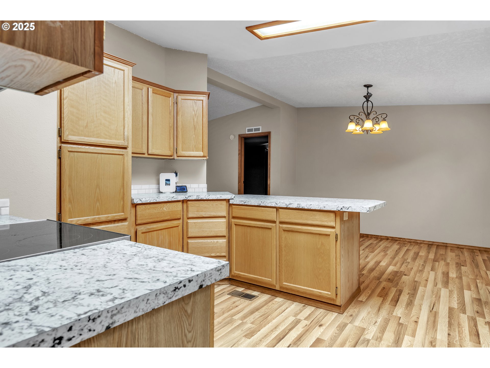 5701 Northeast St Johns Road, Unit 4 Vancouver, WA 98661 - Photo 9 of 28 a kitchen with kitchen island a counter top space appliances and cabinets