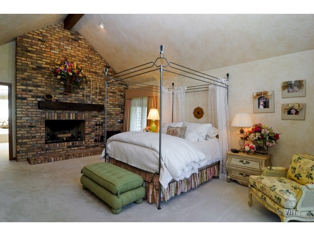 1507 Appleby Road Inverness, IL 60067 - Photo 13 of 25 a bedroom with a bed window and a fireplace
