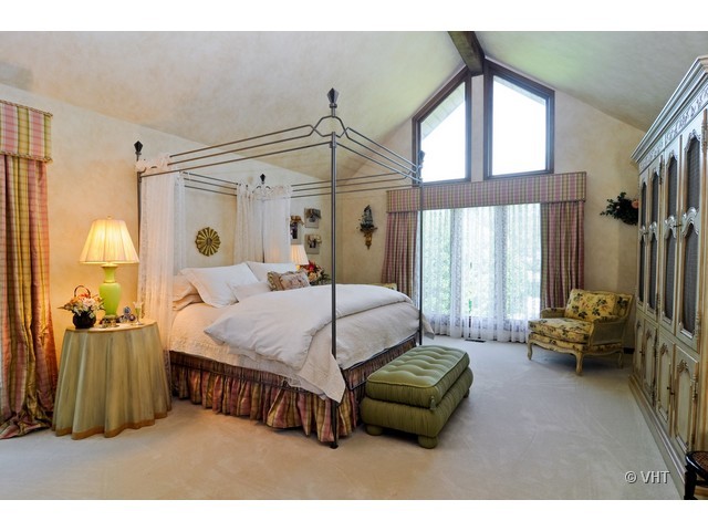 1507 Appleby Road Inverness, IL 60067 - Photo 14 of 25 a bedroom with a bed couch and a window