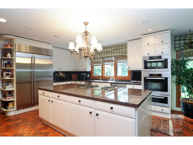 1507 Appleby Road Inverness, IL 60067 - Photo 5 of 25 a kitchen with stainless steel appliances granite countertop a sink stove and refrigerator
