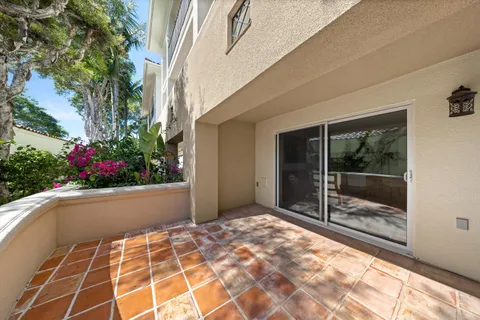 a living room with fireplace furniture and a large window