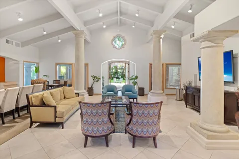 a dining room with furniture and wooden floor