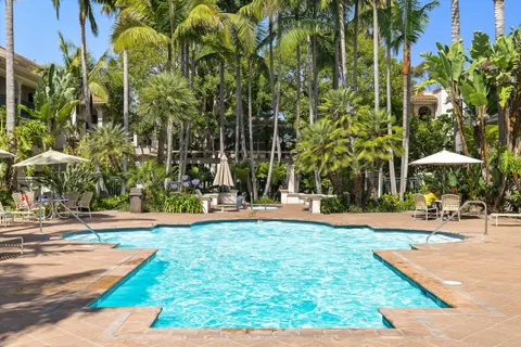 a view of a swimming pool with an outdoor space and seating area