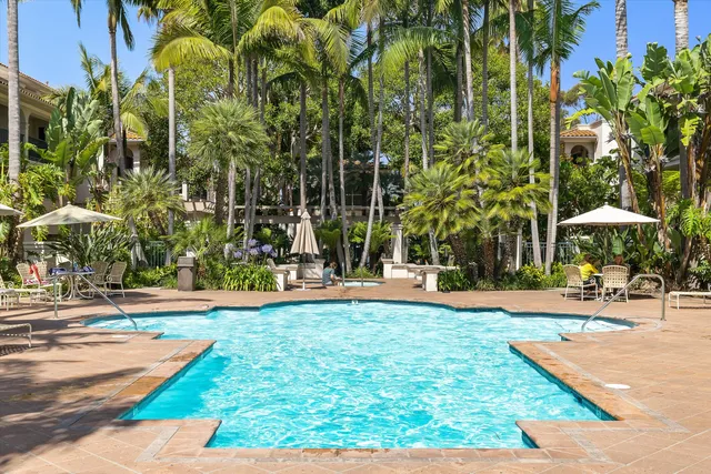 a view of a swimming pool with an outdoor space and seating area