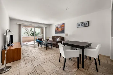 a view of a livingroom with furniture and a flat screen tv