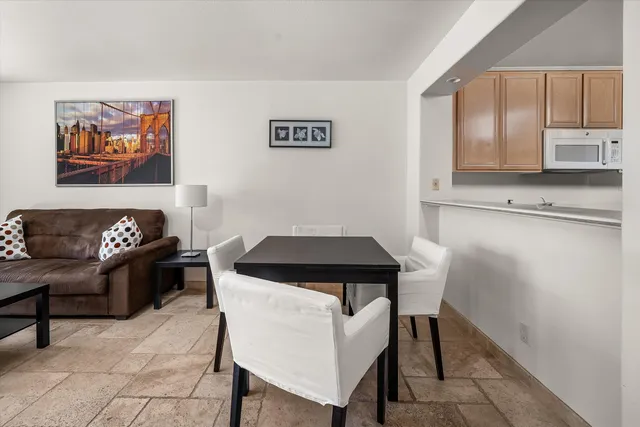 a kitchen with a table and chairs