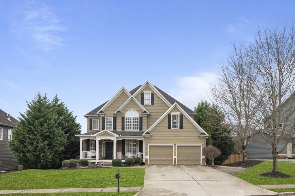 4025 Gold Mill Ridge Canton, GA 30114 - Photo 1 of 1 a front view of a house with garden