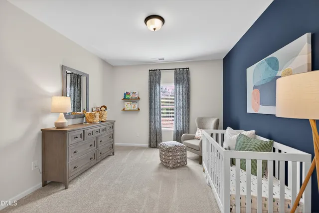 a bedroom with furniture and a dresser