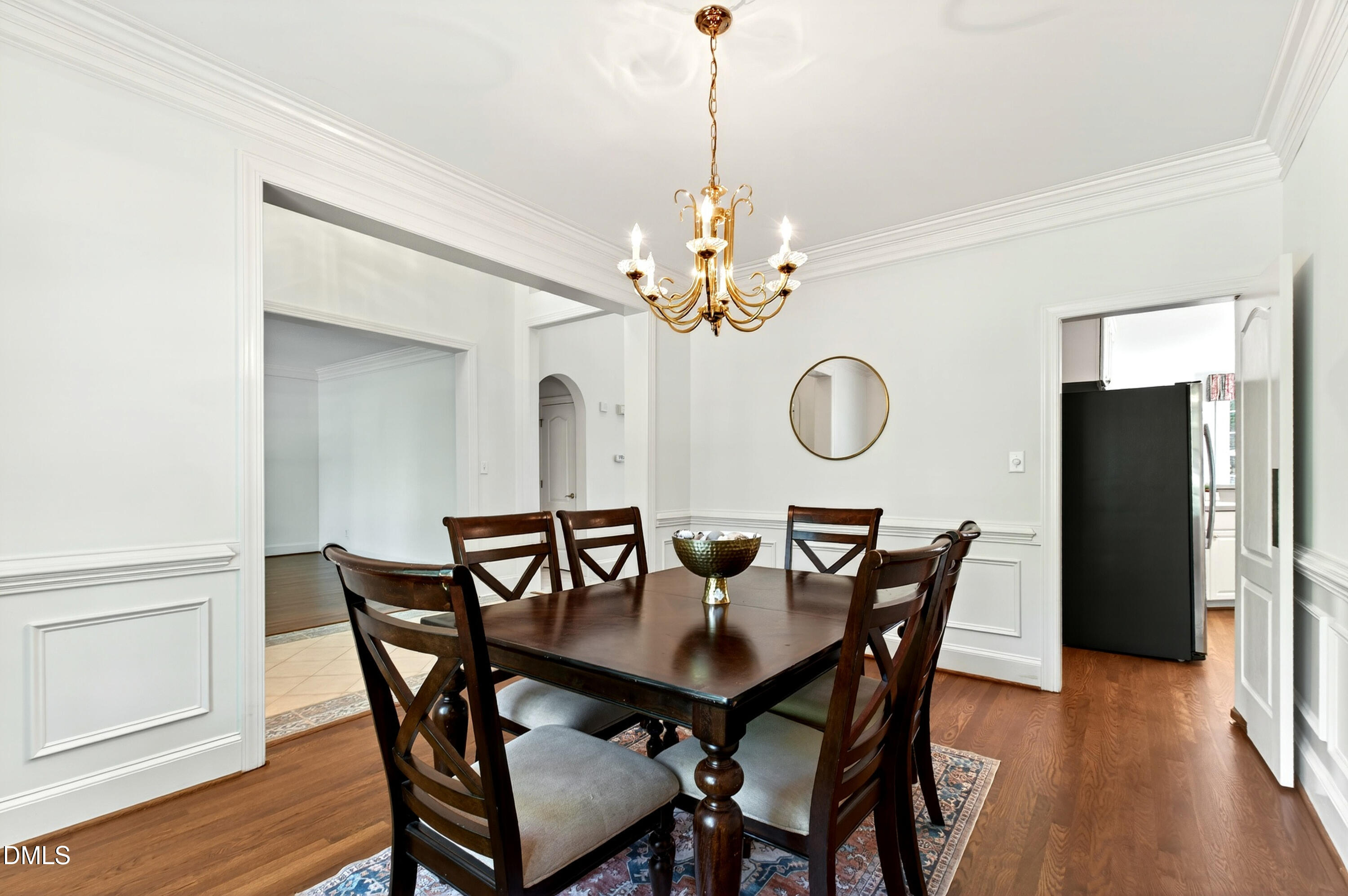 2721 Glassman Lane Raleigh, NC 27606 - Photo 18 of 74 a view of a dining room with furniture and wooden floor