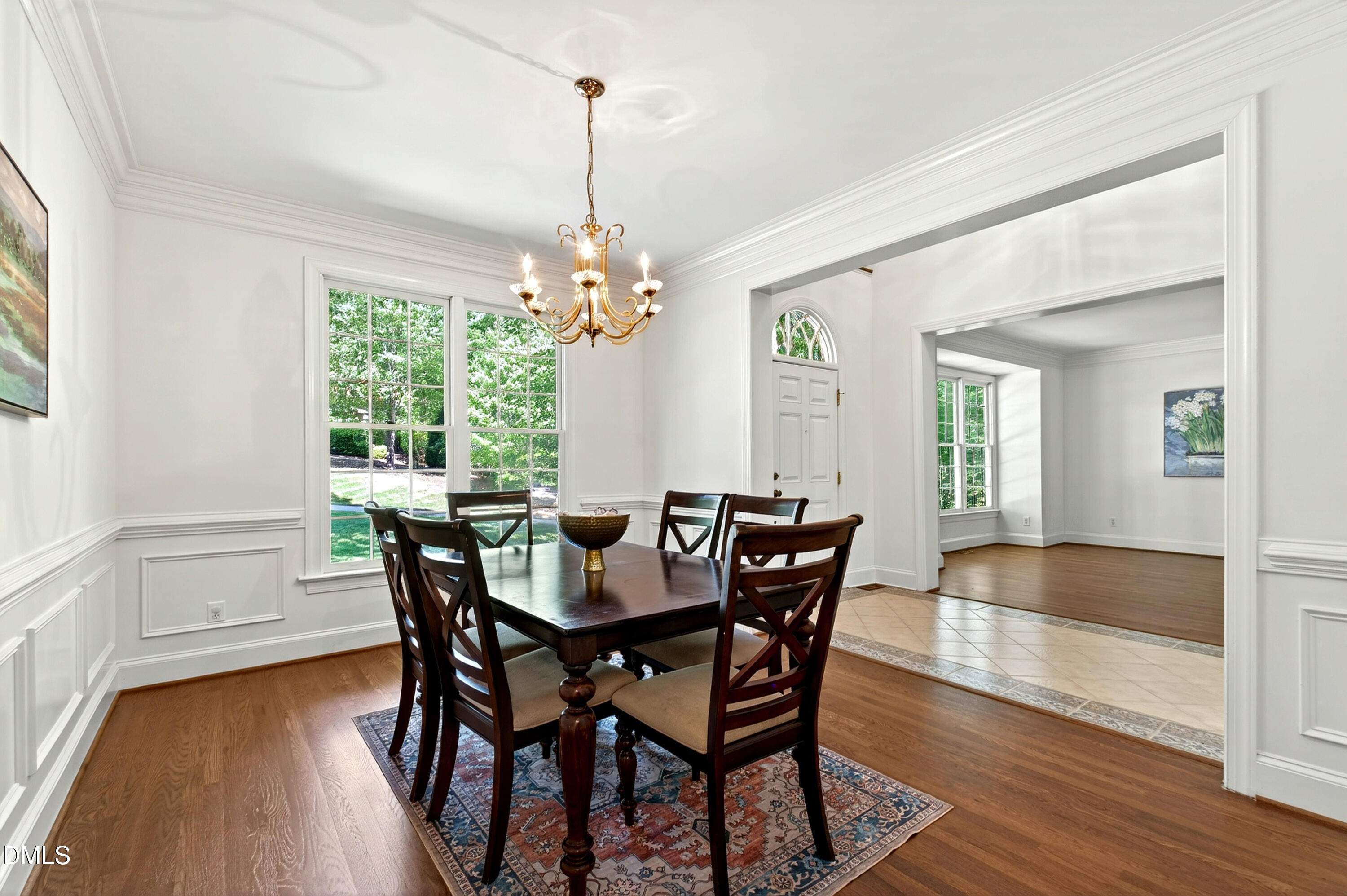 2721 Glassman Lane Raleigh, NC 27606 - Photo 19 of 74 a view of a dining room with furniture window and wooden floor