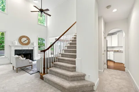 a kitchen with stainless steel appliances a stove a sink a refrigerator a microwave a sink and cabinets
