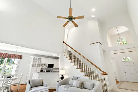 a view of a hallway view with wooden floor and staircase