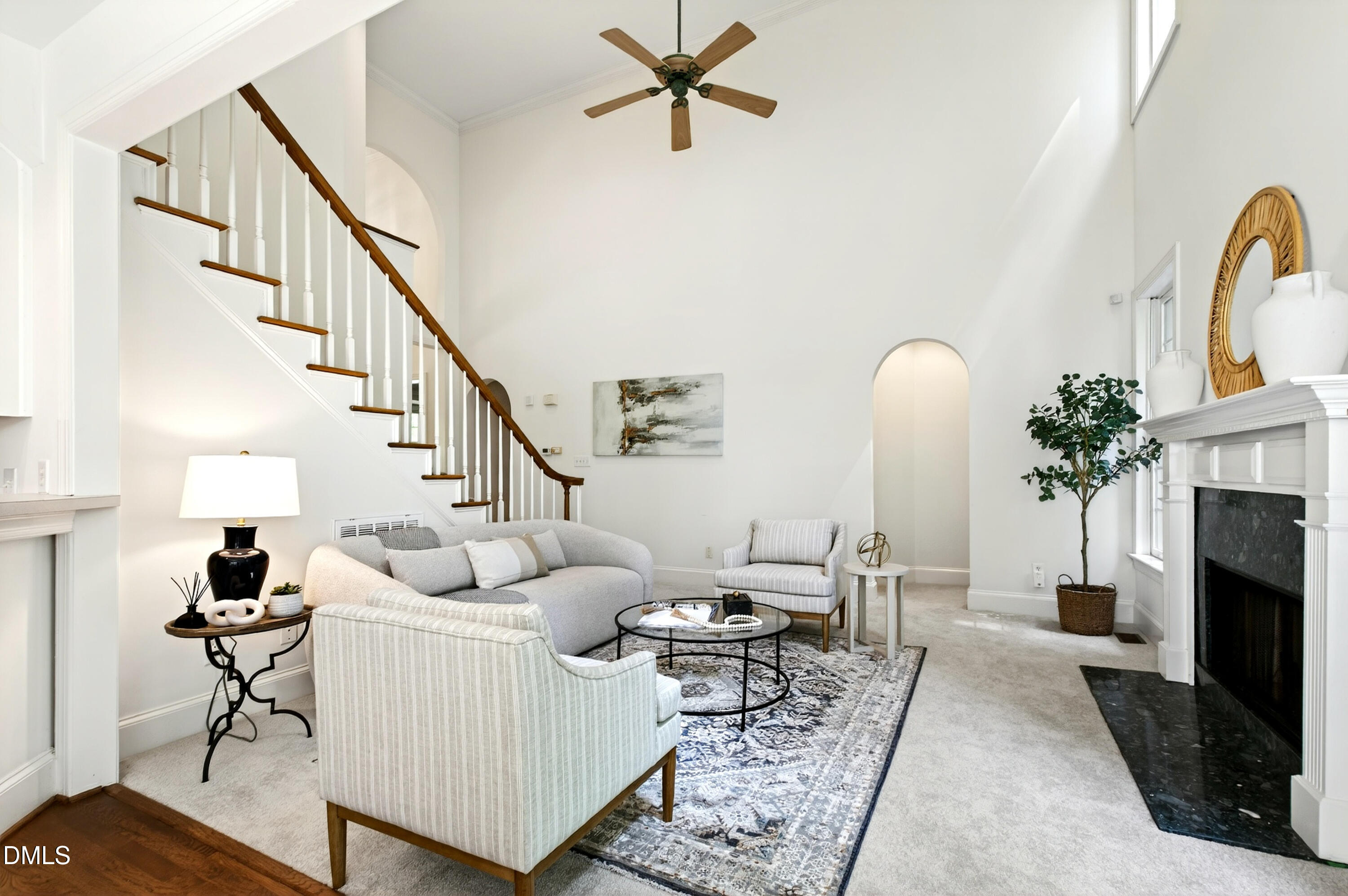 2721 Glassman Lane Raleigh, NC 27606 - Photo 25 of 74 a living room with furniture a fireplace and a potted plant