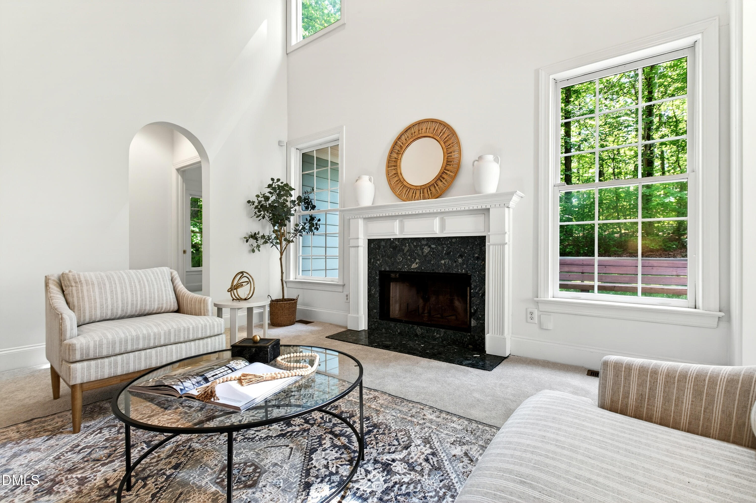 2721 Glassman Lane Raleigh, NC 27606 - Photo 26 of 74 a living room with furniture a fireplace a window and a fireplace
