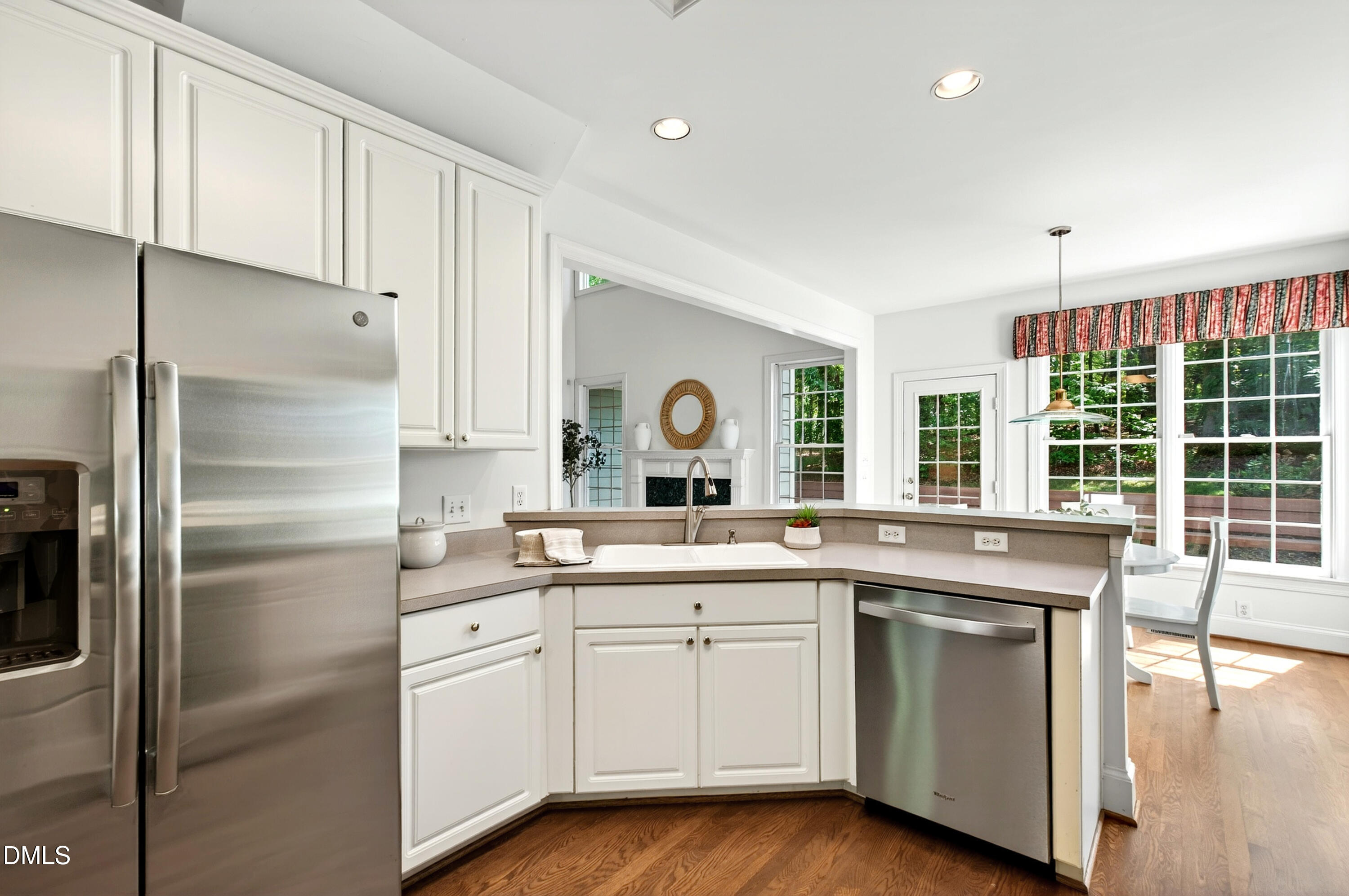 2721 Glassman Lane Raleigh, NC 27606 - Photo 33 of 74 a kitchen with a sink stove and refrigerator