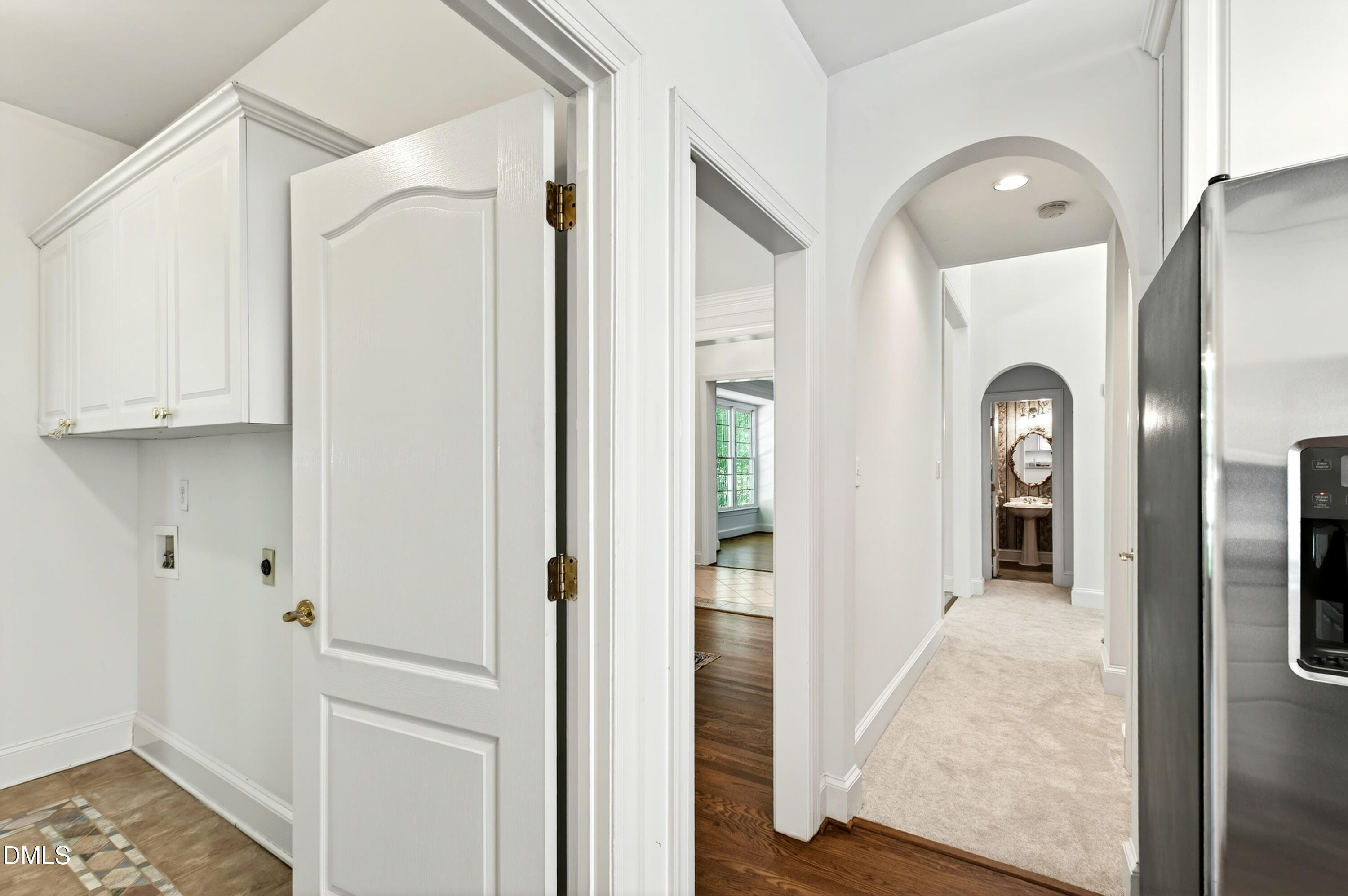2721 Glassman Lane Raleigh, NC 27606 - Photo 36 of 74 a view of a hallway view with wooden floor and staircase