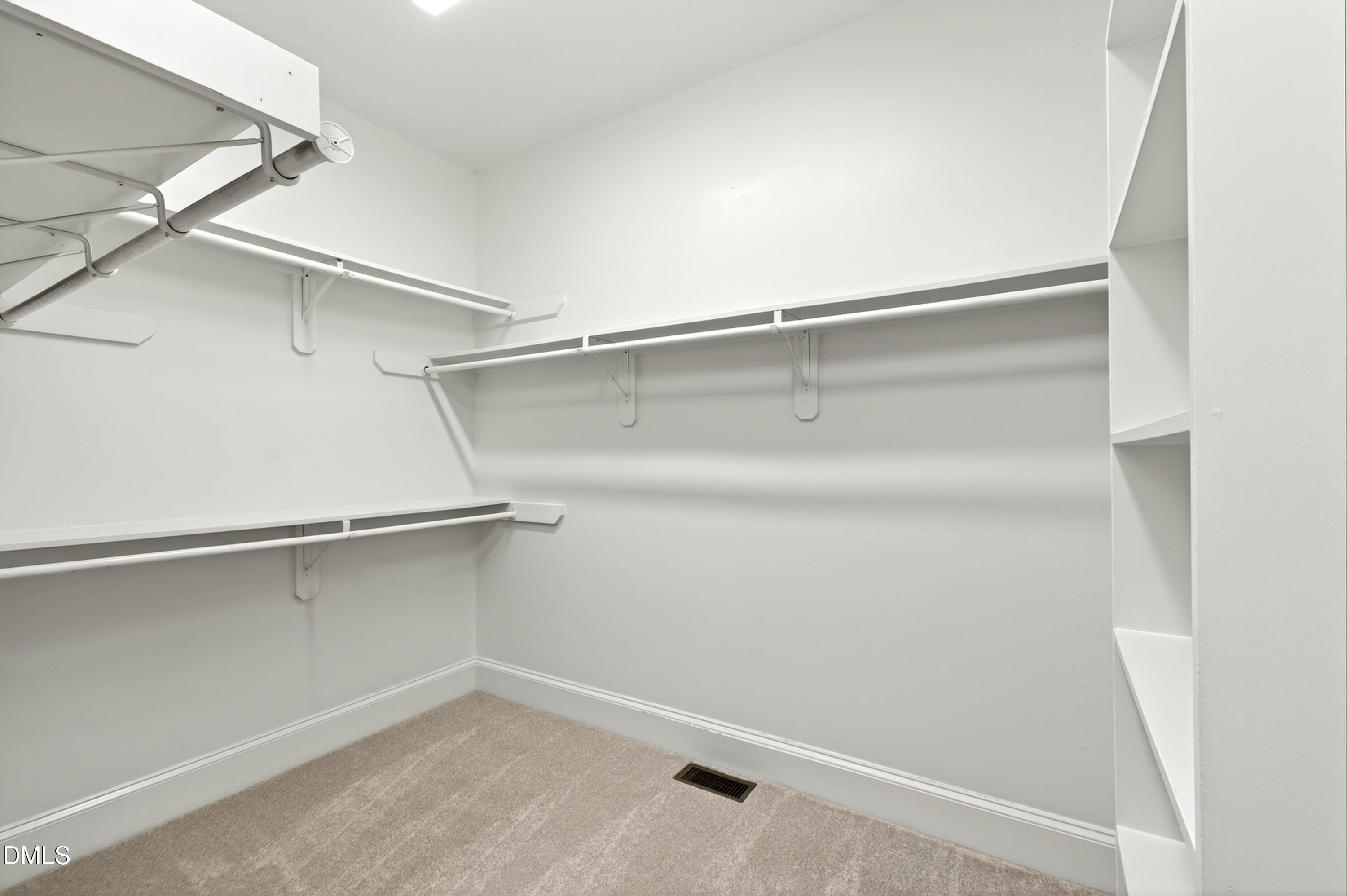 2721 Glassman Lane Raleigh, NC 27606 - Photo 41 of 74 a view of an empty walk in closet