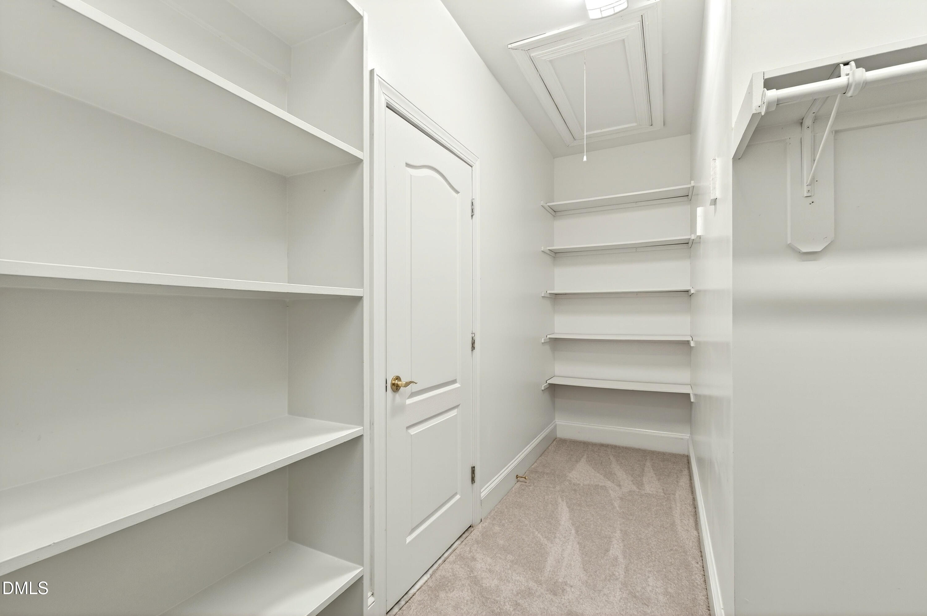 2721 Glassman Lane Raleigh, NC 27606 - Photo 42 of 74 a view of walk in closet with empty racks