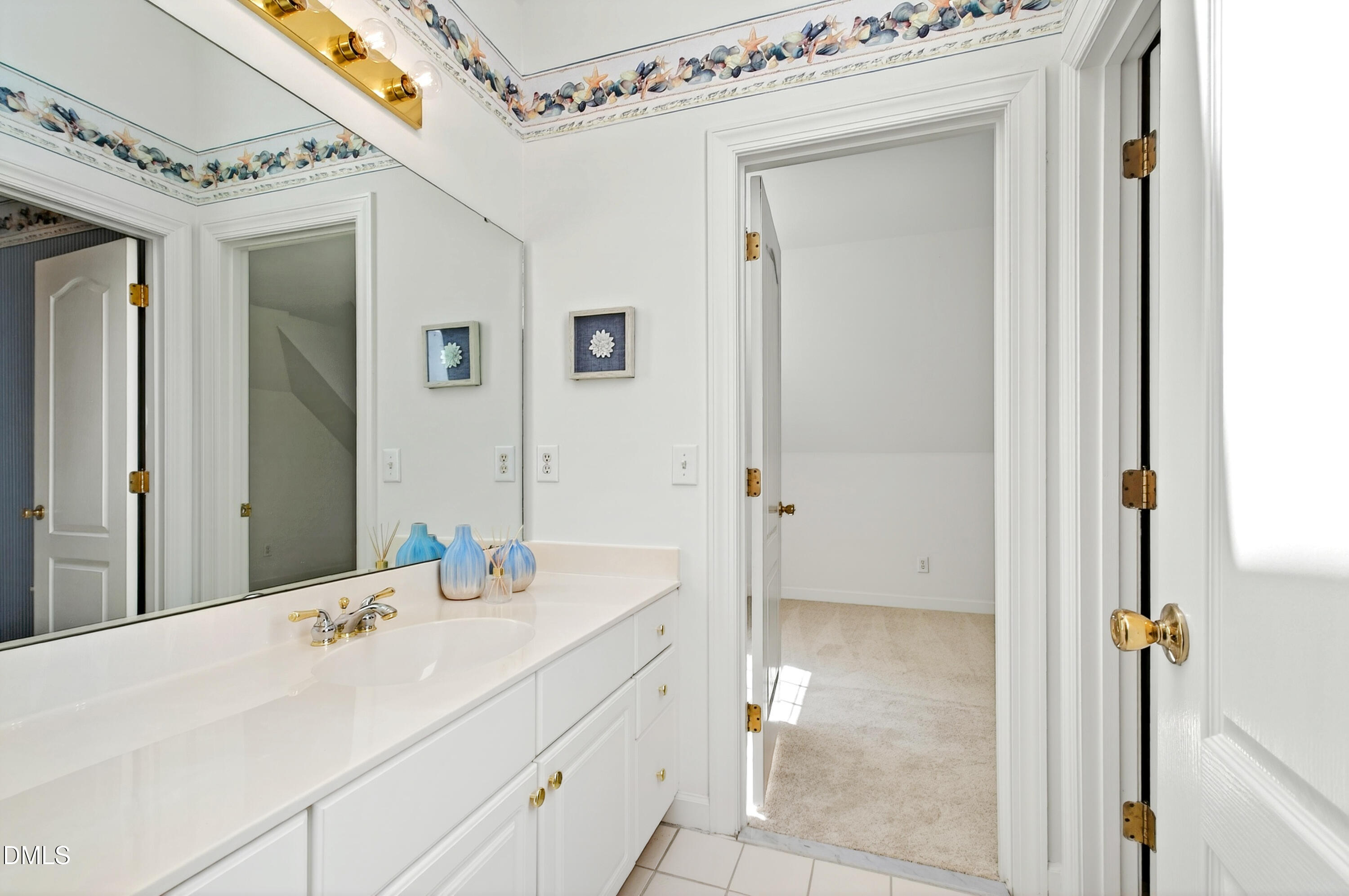 2721 Glassman Lane Raleigh, NC 27606 - Photo 46 of 74 a en suite bathroom with a sink and a mirror