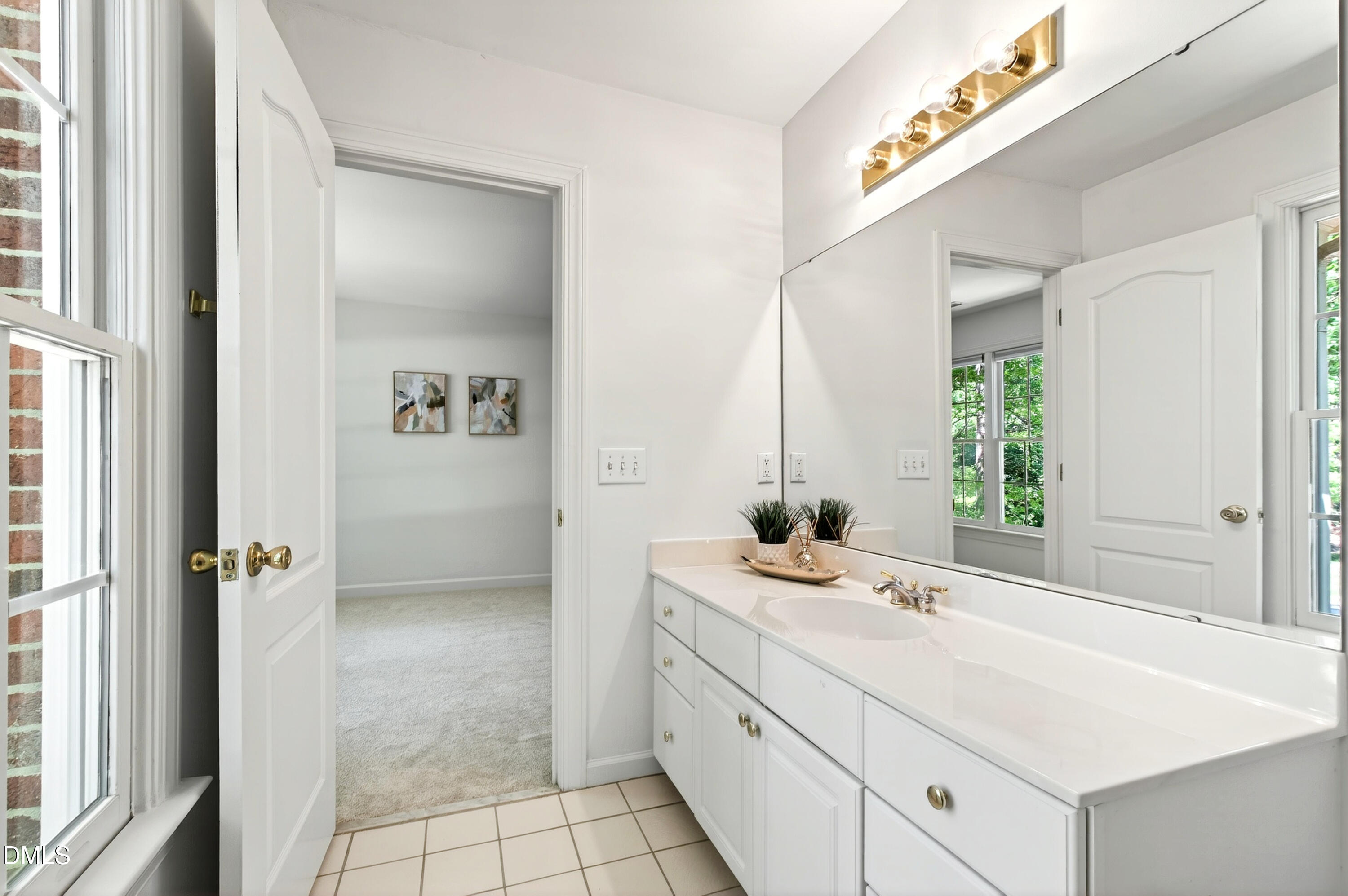 2721 Glassman Lane Raleigh, NC 27606 - Photo 57 of 74 a bathroom with a sink and a mirror