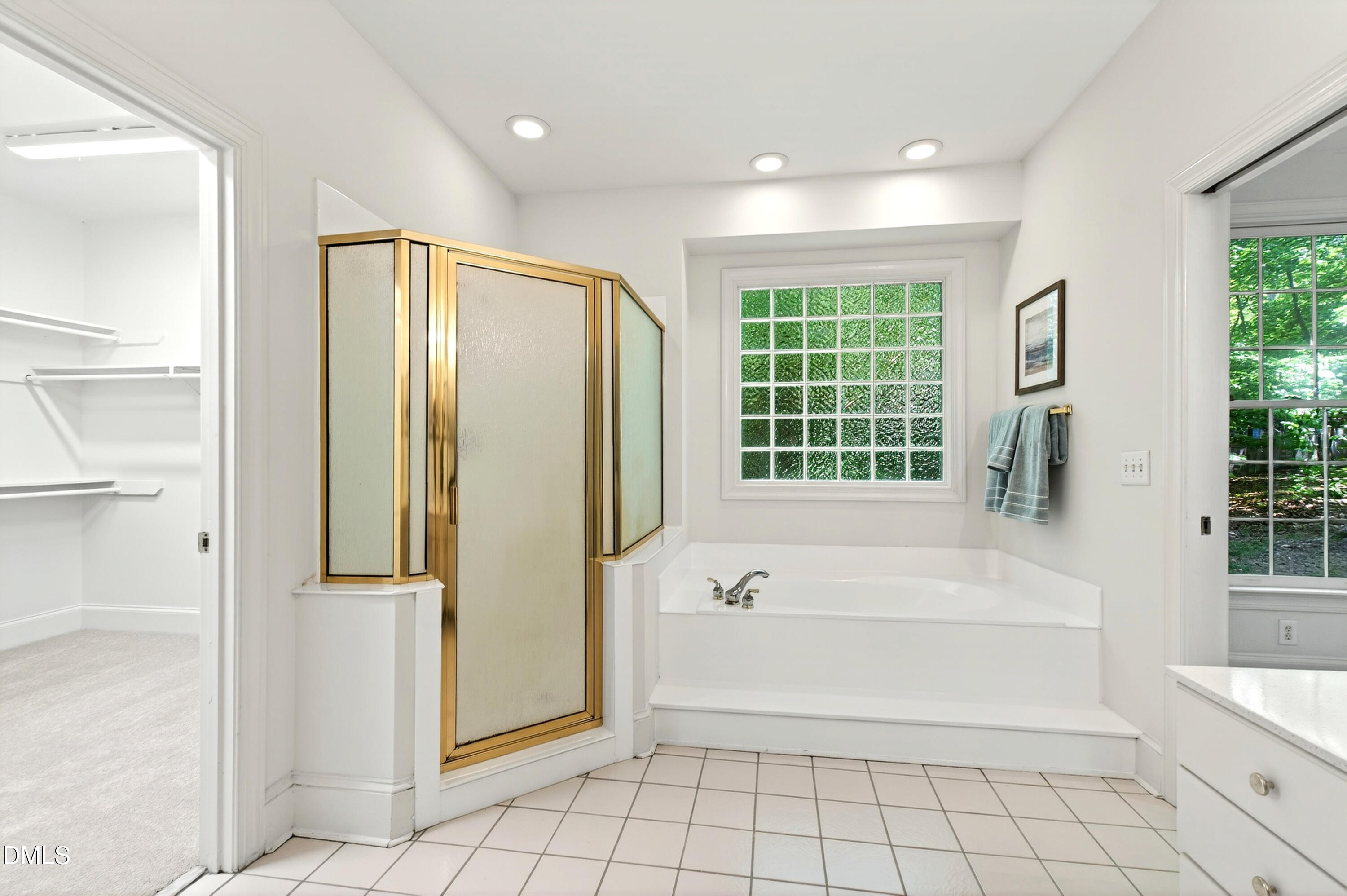 2721 Glassman Lane Raleigh, NC 27606 - Photo 5 of 74 a bathroom with a bathtub and a shower