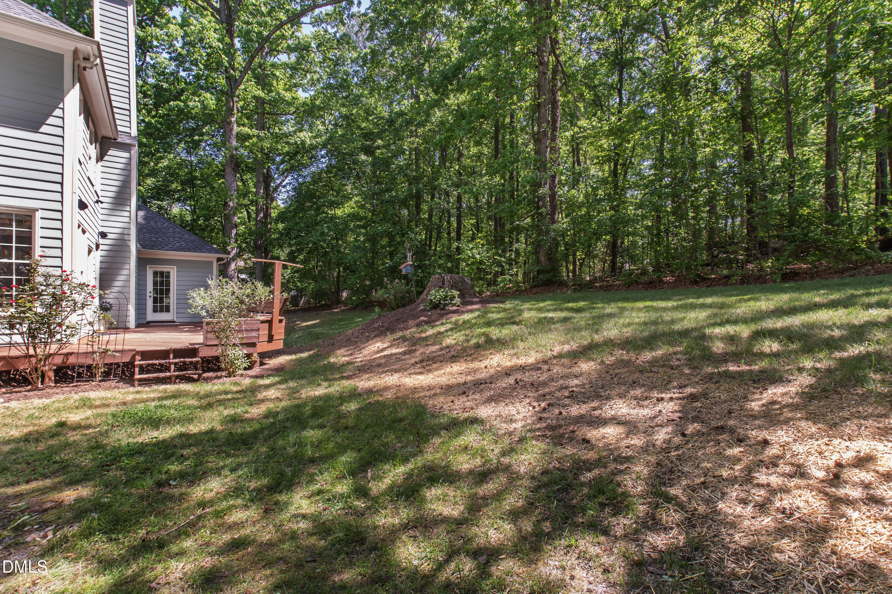 2721 Glassman Lane Raleigh, NC 27606 - Photo 61 of 74 a backyard of a house with table and chairs