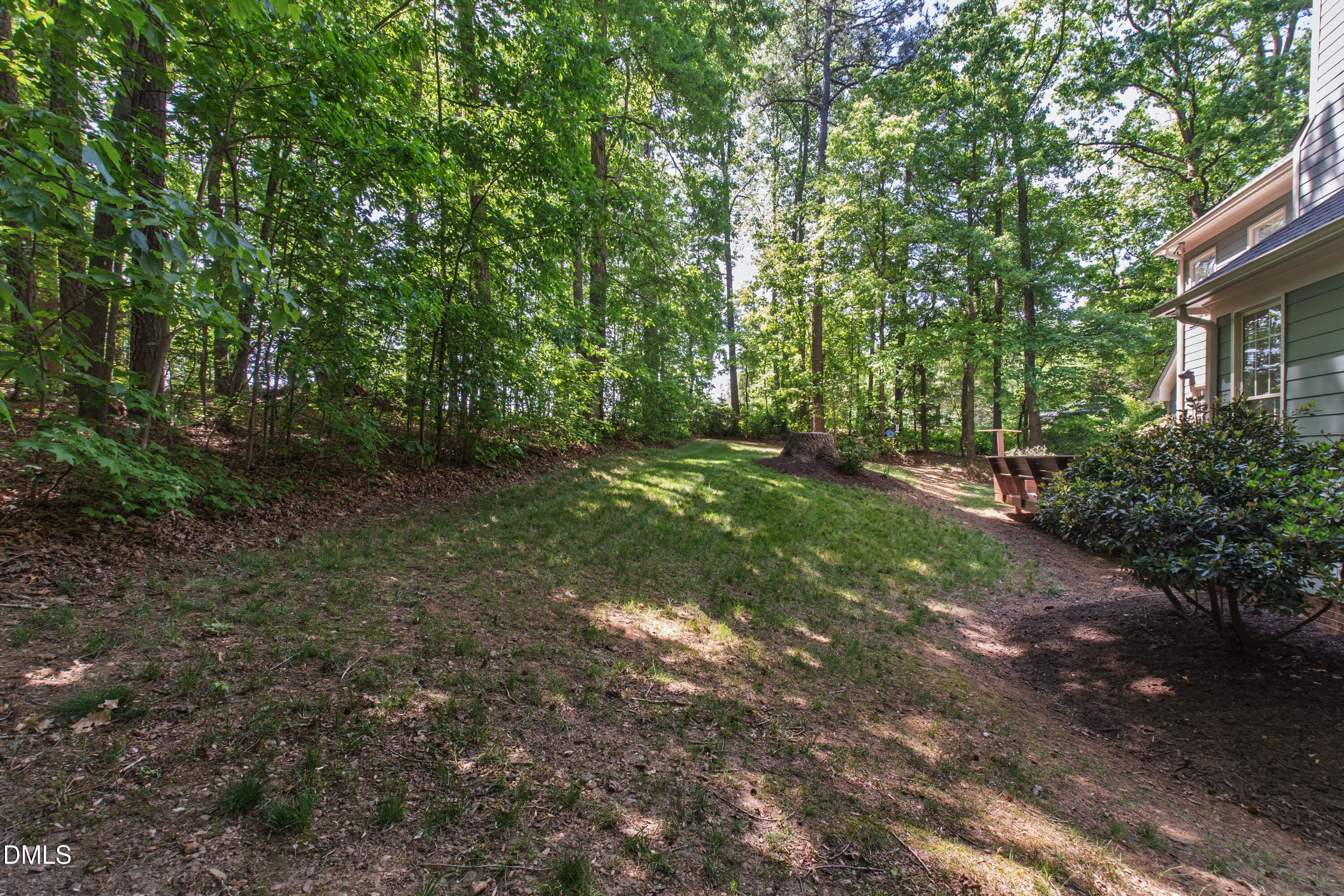 2721 Glassman Lane Raleigh, NC 27606 - Photo 63 of 74 a backyard of a house with lots of green space