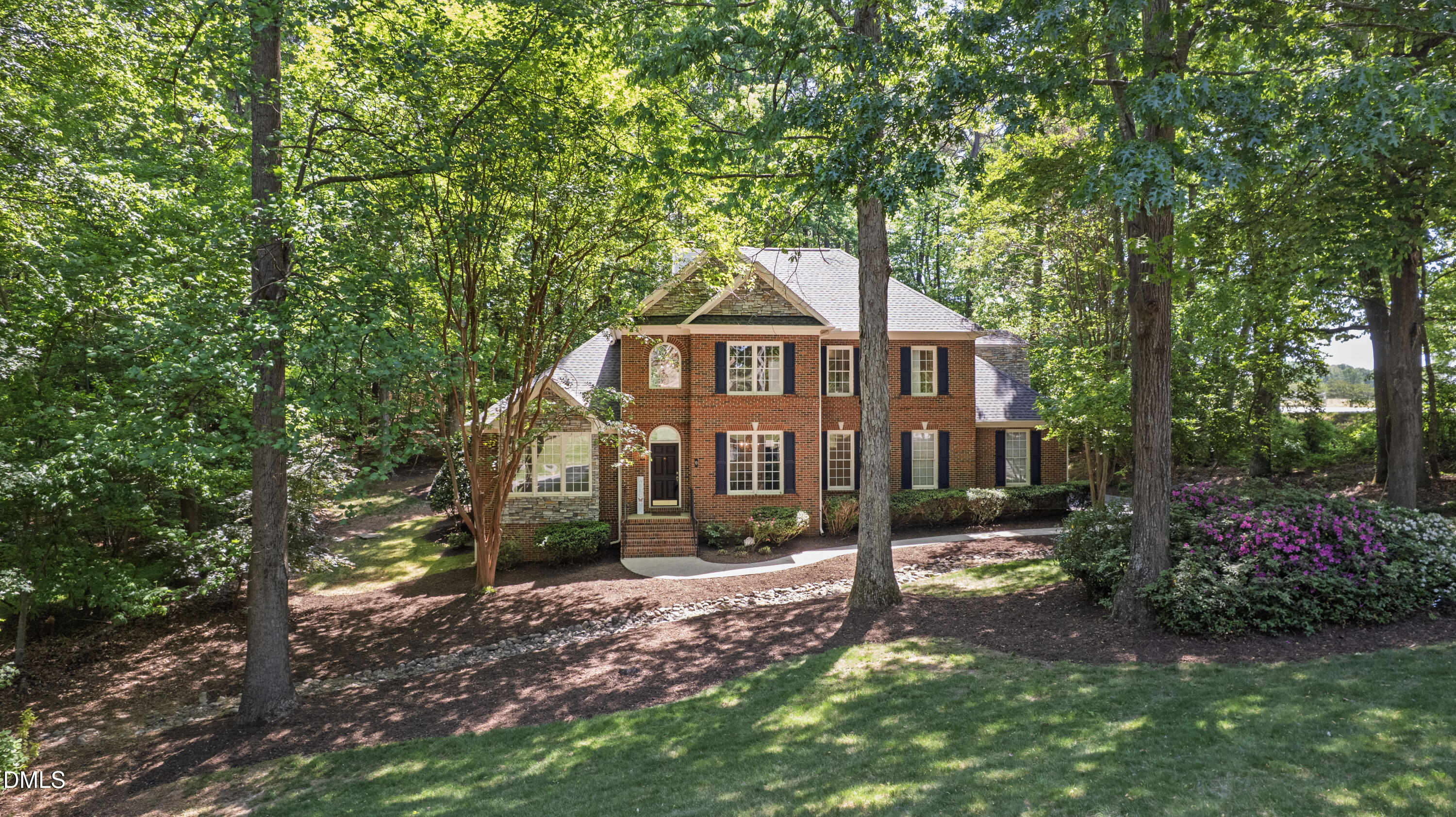 2721 Glassman Lane Raleigh, NC 27606 - Photo 64 of 74 a front view of a house with a garden