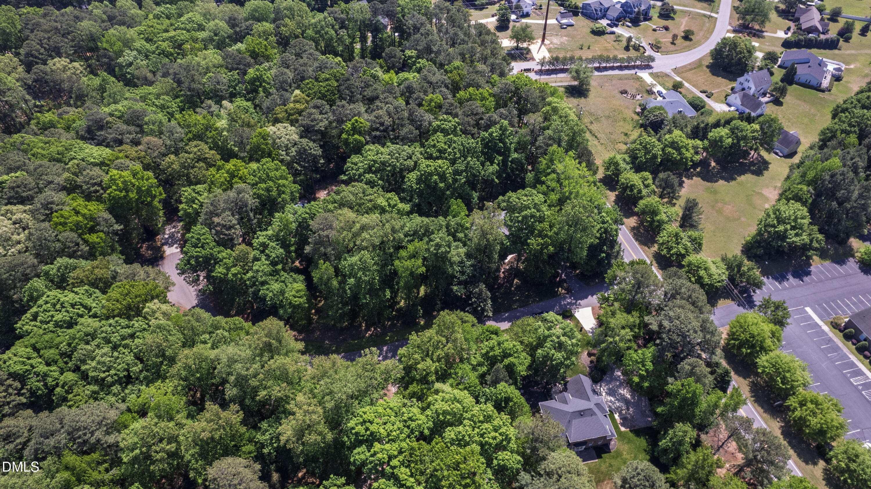 2721 Glassman Lane Raleigh, NC 27606 - Photo 69 of 74 an aerial view of residential house with outdoor space and trees all around